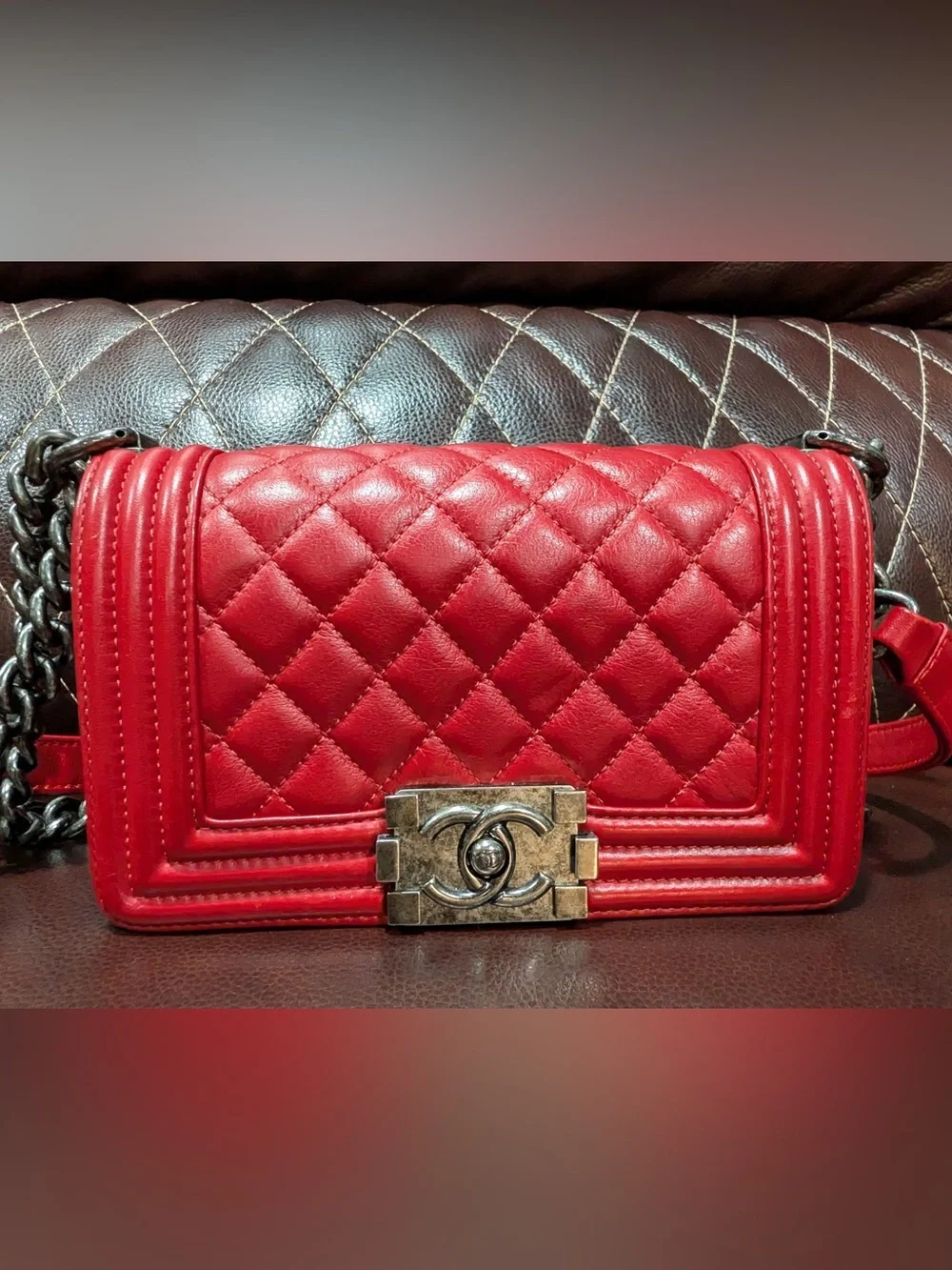 CHANEL Red leather small Boy with gunmetal tone chain